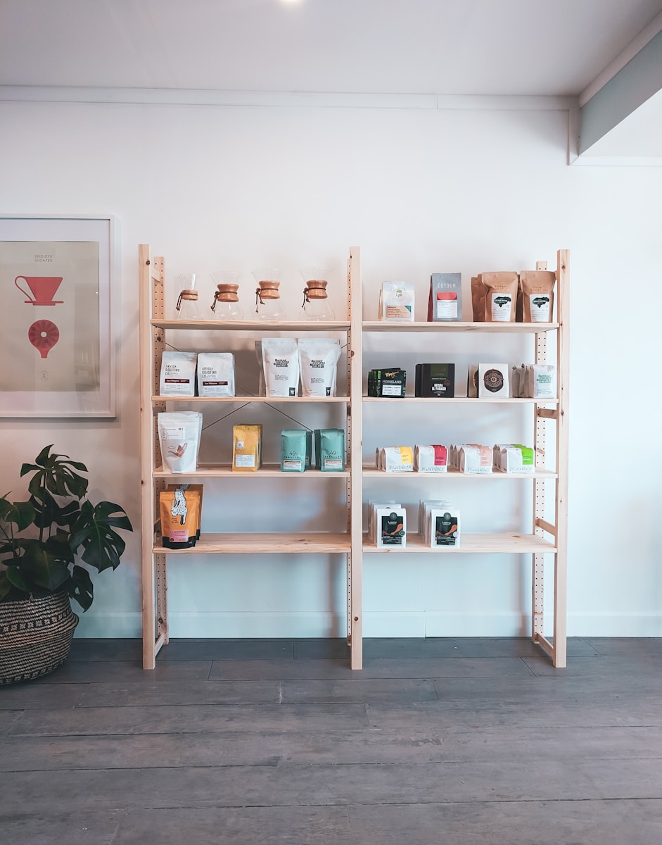brown wooden shelf with books and figurines